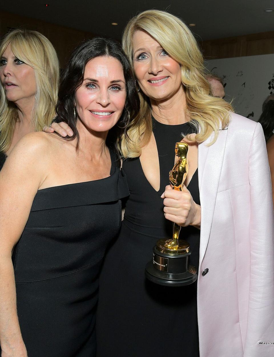 Longtime pals Courteney Cox and Laura Dern celebrate Dern's first Academy Award win for her role in <em>Marriage Story </em>at the 2020 Netflix Oscar Afterparty. 