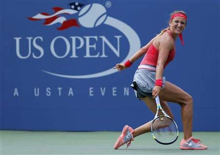 Victoria Azarenka of Belarus checks a shot to Alize Cornet of France at the U.S. Open tennis championships in New York August 31, 2013. REUTERS/Kena Betancur