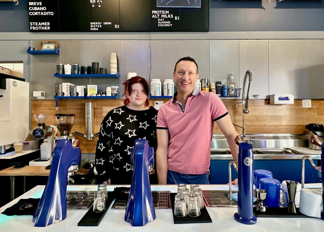 Sean Grorich and his daughter, Evelyn, stand behind the counter of the coffee shop at Pinky Promise Coffee Roasters in Sturgeon Bay, which holds its grand opening Memorial Day weekend.