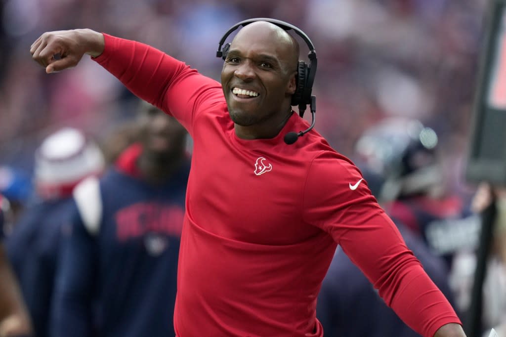 Houston Texans head coach DeMeco Ryans celebrates on the sideline during the first half of an NFL football game against the Tennessee Titans, Sunday, Dec. 31, 2023, in Houston. (AP Photo/Eric Christian Smith)