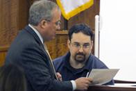 Prosecutor Patrick Bomberg (L) reviews an exhibit with Needletech employee Michael Ribiero, who heard popping sounds on the night in question, during the murder trial of former NFL player Aaron Hernandez at the Bristol County Superior Court in Fall River, Massachusetts, February 23, 2015. Hernandez is charged with the 2013 murder of Odin Lloyd, 27, a semiprofessional football player who had been dating the sister of Hernandez's fiancee. REUTERS/Dominick Reuter/Pool (UNITED STATES)