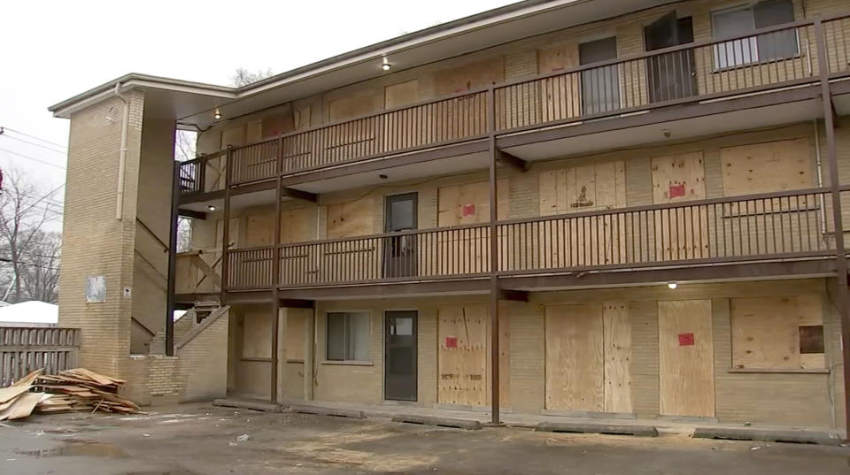 This photo taken from video provided by ABC 7 Chicago shows an apartment building complex that was boarded up with plywood, Sunday, Jan. 7, 2024, in Harvey, Ill. Some residents said that they were still inside their units when the boarding began. (ABC 7 Chicago via AP)