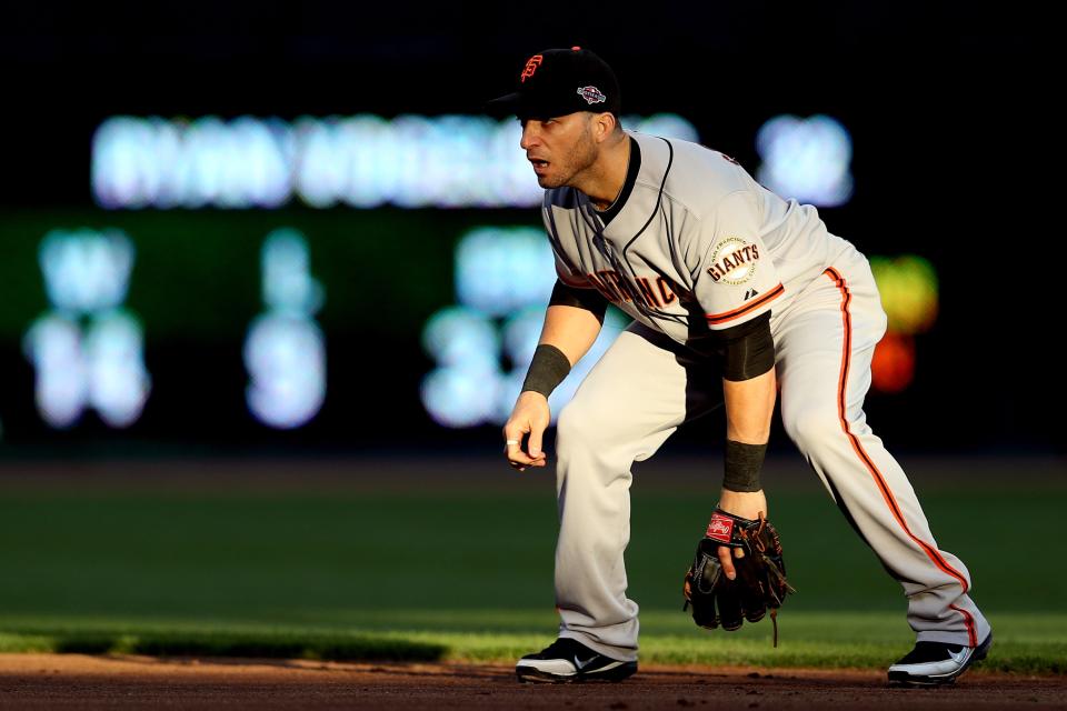 Marco Scutaro #19 of the San Francisco Giants plays defense in the first inning against the Cincinnati Reds in Game Three of the National League Division Series at the Great American Ball Park on October 9, 2012 in Cincinnati, Ohio. (Photo by Jonathan Daniel/Getty Images)