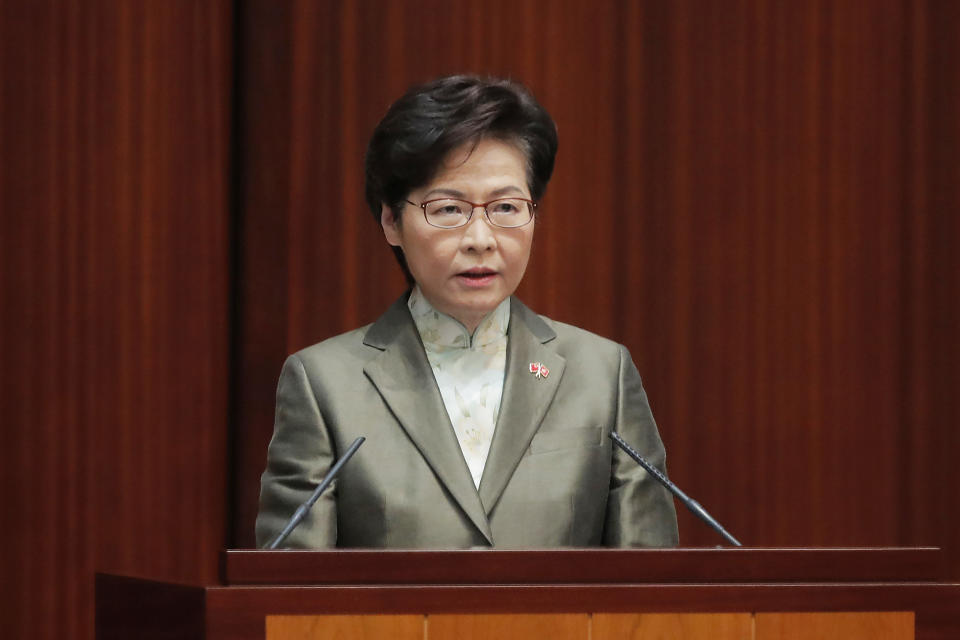 Hong Kong Chief Executive Carrie Lam delivers her policies at chamber of the Legislative Council in Hong Kong, Wednesday, Nov. 25, 2020. Lam said Wednesday that the city's new national security law has been “remarkably effective in restoring stability” after months of political unrest, and that bringing normalcy back to the political system is an urgent priority. (AP Photo/Kin Cheung)