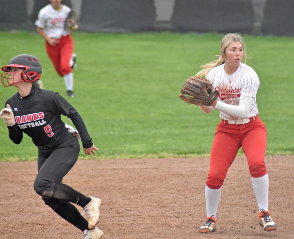 Coldwater shortstop Rylie VanAken (2) looks to gun down a runner at first as the Cardinals faced Marshall Tuesday