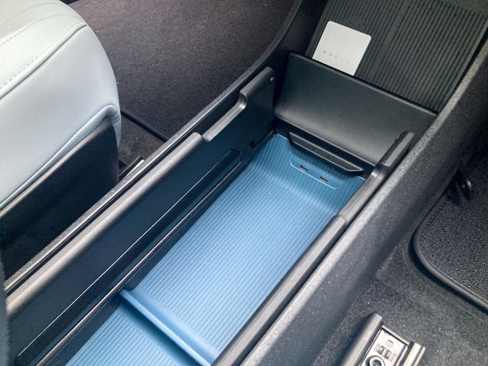 An open glove box in the Volvo EX30, which has a storage cubby and several USB-C ports.