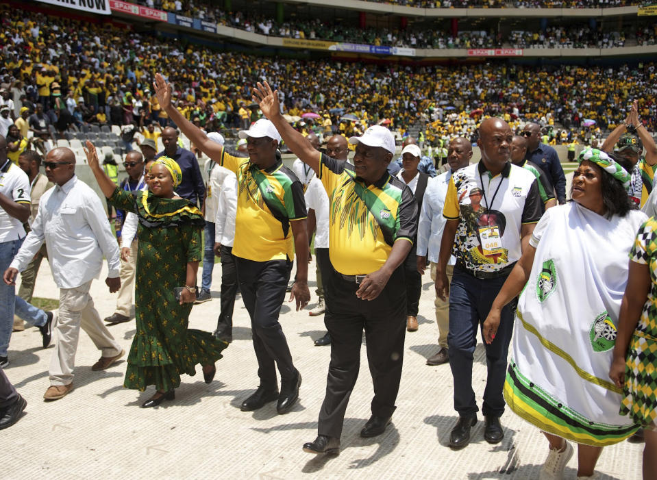 African National Congress president Cyril Ramaphosa, third from right, greets supporters on his arrival at Mbombela, South Africa, Stadium Saturday, Jan 13, 2024. The ruling party celebrated the 112th anniversary of its establishment ahead of national elections, expected to be the toughest since it came to power in 1994. (AP Photo)