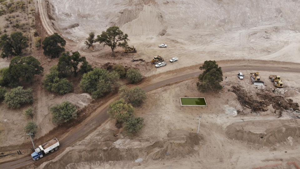 Construction continues for a new train line in northern Mexico, in San Lorenzo, Sonora state, Mexico, Monday, Nov. 13, 2023. Residents in the northern state of Sonora are battling the new train line which they say threatens to displace their homes and cut up the local ecosystem. (AP Photo/Luis Castillo)