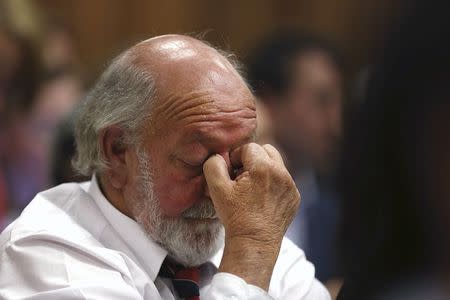 Barry Steenkamp, father of Reeva Steenkamp, reacts as Olympic and Paralympic track star Oscar Pistorius (unseen) appears to hear the verdict during his trial at the North Gauteng High Court in Pretoria September 12, 2014. REUTERS/Alon Skuy/Pool