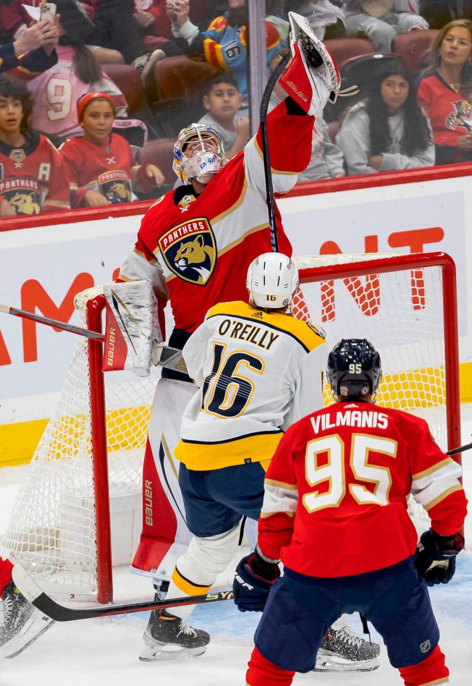 Florida Panthers goalie Spencer Knight (30) blocks a shot by the Nashville Predators in the second period of an NHL preseason game at the Amerant Bank Arena on Monday, Sept. 25, 2023, in Sunrise, Fla.