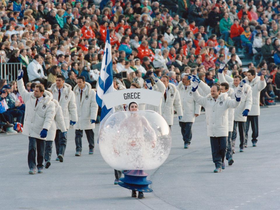 woman wearing a snow globe costume at olympics