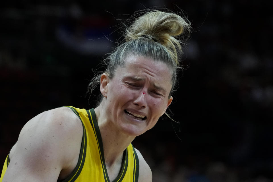 Australia's Sami Whitcomb reacts after she was hit in the face with the ball during their game at the women's Basketball World Cup against Serbia in Sydney, Australia, Sunday, Sept. 25, 2022. (AP Photo/Mark Baker)