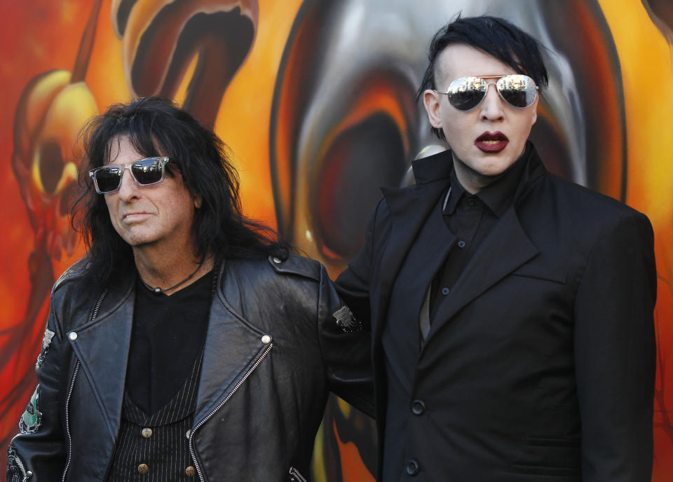 Marilyn Manson (R) and Alice Cooper pose at the fifth annual Golden Gods awards at Club Nokia in Los Angeles, California May 2, 2013.   REUTERS/Mario Anzuoni  (UNITED STATES - Tags: ENTERTAINMENT)