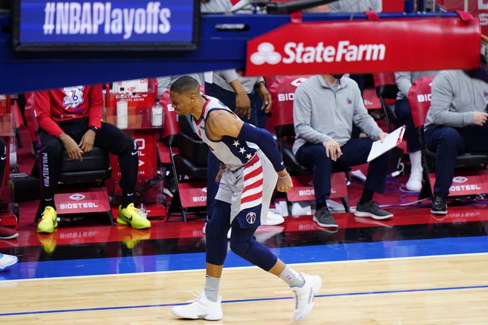 Washington Wizards' Russell Westbrook limps down the court after an injury during the second half of Game 2 in a first-round NBA basketball playoff series against the Philadelphia 76ers, Wednesday, May 26, 2021, in Philadelphia. (AP Photo/Matt Slocum)