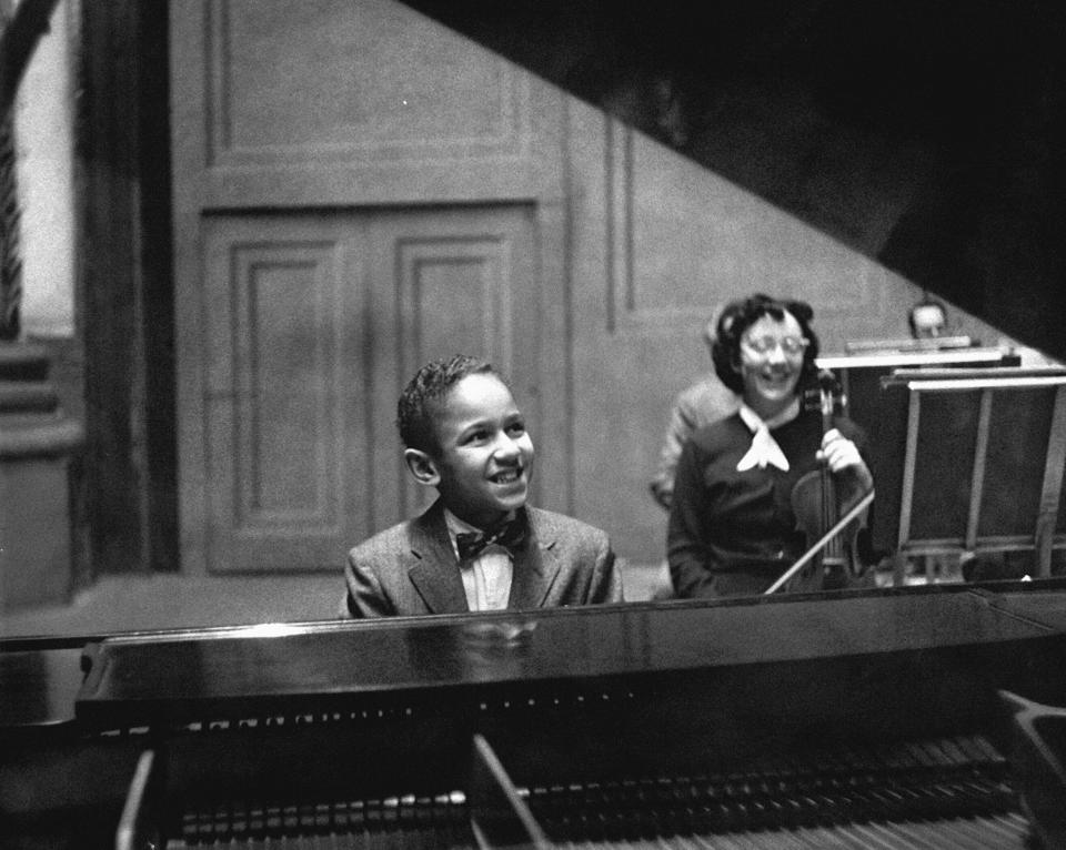 This image released by the Philadelphia Orchestra shows Andre Watts, 10, performing the first movement of Haydn’s Concerto in D major on Jan.12, 1957, in Philadelphia. Watts, whose nationally televised debut with the New York Philharmonic as a 16-year-old in 1963, launching an international career, died, Wednesday in Bloomington, Ind. He was 77. (Adrian Siegel/Philadelphia Orchestra via AP)