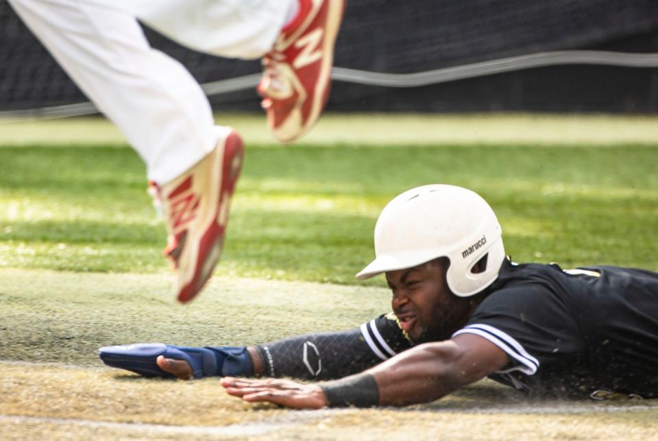 Sacred Heart-Griffin’s RJ Jimerson (15) slides under the feat of Pleasant Plains pitcher Mason Williams (3) to score a run in the Class 2A Regional Finals at Comstock Field in Springfield, Ill., Monday, June 7, 2021. [Justin L. Fowler/The State Journal-Register] 