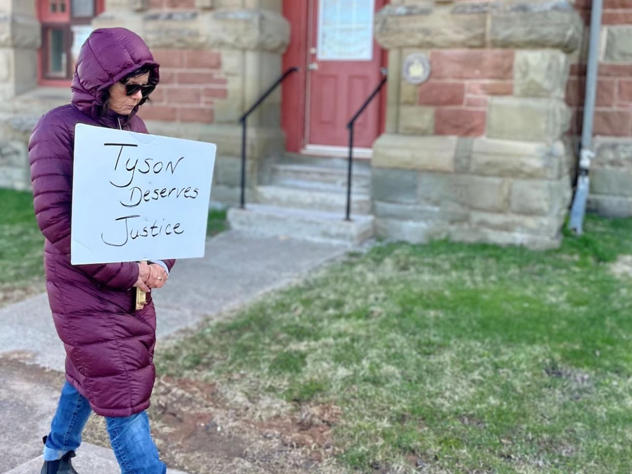 About 20 people were outside the courthouse in Georgetown in support of Tyson MacDonald's family while the hearing was held inside. (Steve Bruce/CBC - image credit)