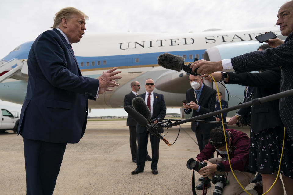 President Donald Trump talks to reporters before boarding Air Force One for a trip to Phoenix to visit a Honeywell plant that manufactures protective equipment, Tuesday, May 5, 2020, in Andrews Air Force Base, Md. (AP Photo/Evan Vucci)