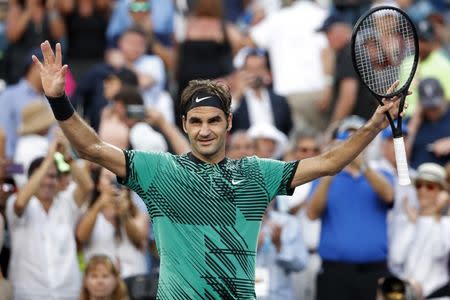 Mar 28, 2017; Miami, FL, USA; Roger Federer of Switzerland celebrates after his match against Roberto Bautista Agut of Spain (not pictured) on day eight of the 2017 Miami Open at Crandon Park Tennis Center. Federer won 7-6(5), 7-6(4). Mandatory Credit: Geoff Burke-USA TODAY Sports