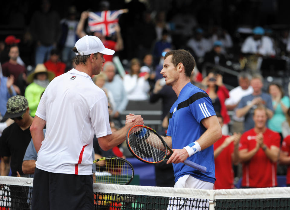 Britain's Andy Murray, right, shakes hands with United States' Sam Querrey, left, after defeating Querrey at the Davis Cup tennis matches on Sunday, Feb. 2, 2014, in San Diego. (AP Photo/Denis Poroy)