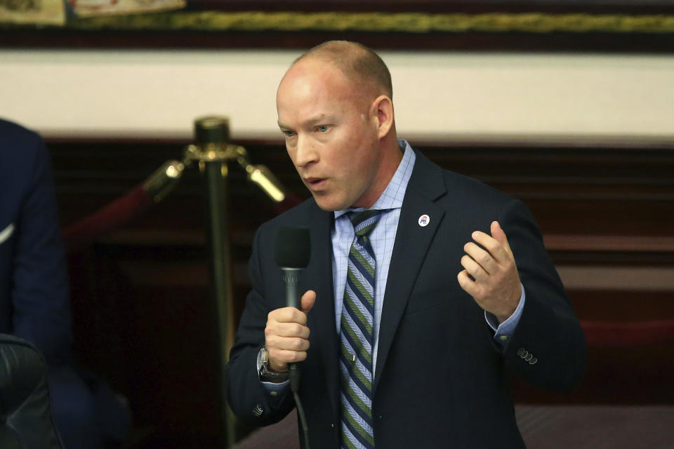 Rep. Spencer Roach, R-North Fort Myers, closes on his sponsored bill to ban the banning of sunscreen containing ingredients that some researchers say harm coral reefs during session Tuesday, March 10, 2020, in Tallahassee, Fla. (AP Photo/Steve Cannon)