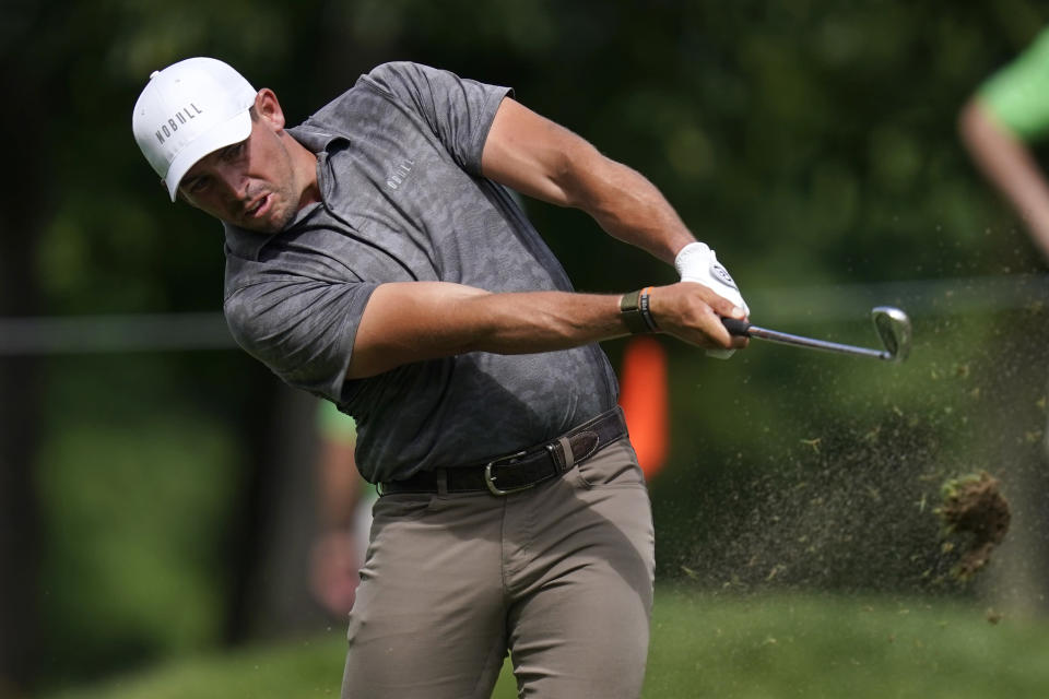 Scott Stallings hits on the 18th fairway during the third round of the John Deere Classic golf tournament, Saturday, July 2, 2022, at TPC Deere Run in Silvis, Ill. (AP Photo/Charlie Neibergall)