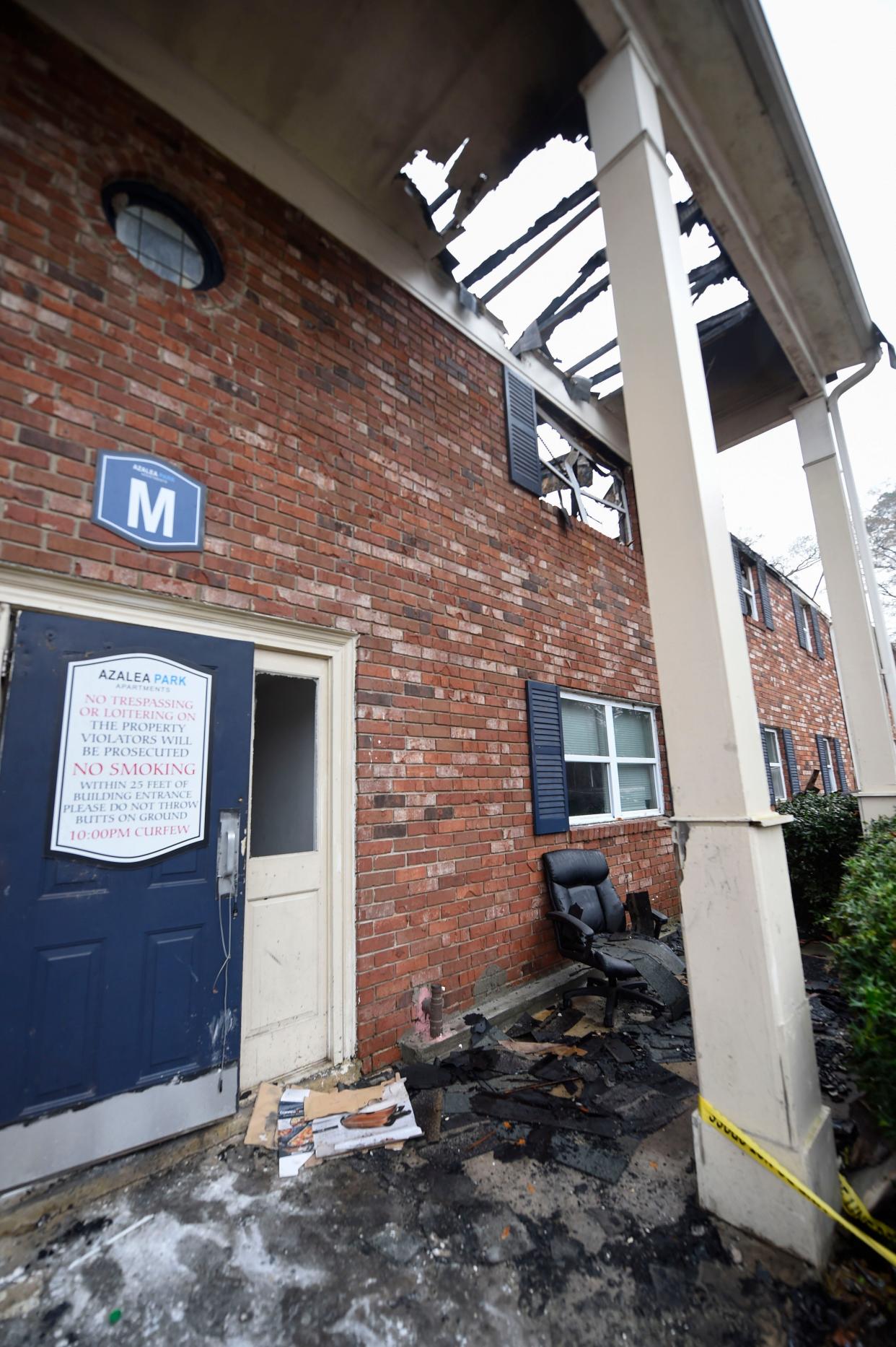 A swivel chair sits outside the remains of building M at Azalea Parks Apartments. The Dec. 8 fire displaced 15 people from their homes.