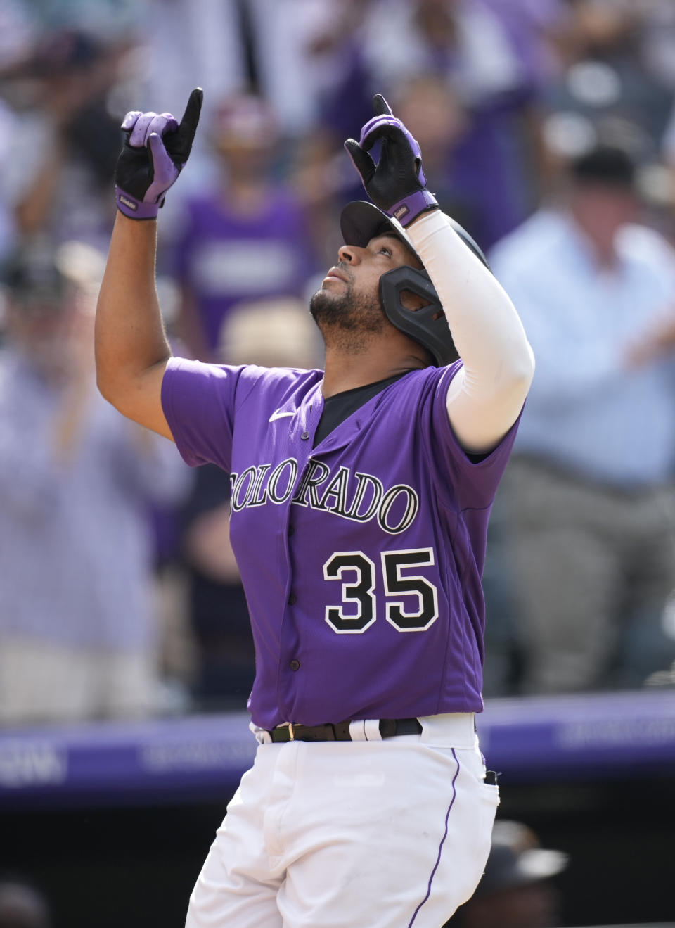 Colorado Rockies' Elias Diaz gestures as he crosses home plate after hitting a solo home run off Pittsburgh Pirates starting pitcher Tyler Anderson in the fifth inning of a baseball game Monday, June 28, 2021, in Denver. (AP Photo/David Zalubowski)