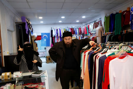 Seyfullaz Niyaz and his wife Mahdiya are seen at their women's clothing store that sells Mahdiya and her daughter's designs in Istanbul, Turkey, January 12, 2019. REUTERS/Murad Sezer