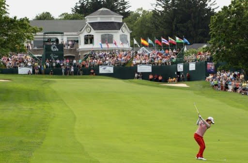 Eun-Hee Ji of South Korea hits her approach shot on the 18th hole during the third round of the Wegmans LPGA Championship