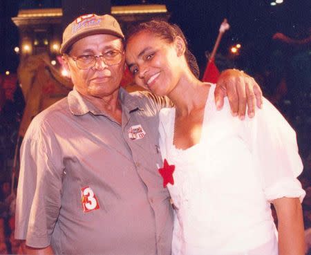 Then-Senator for Acre State, Marina Silva (R), stands with her father, Pedro Augusto da Silva, during her campaign for re-election in Rio Branco, in this handout photo taken in 2002. REUTERS/Campaign Marina Silva/Handout via Reuters