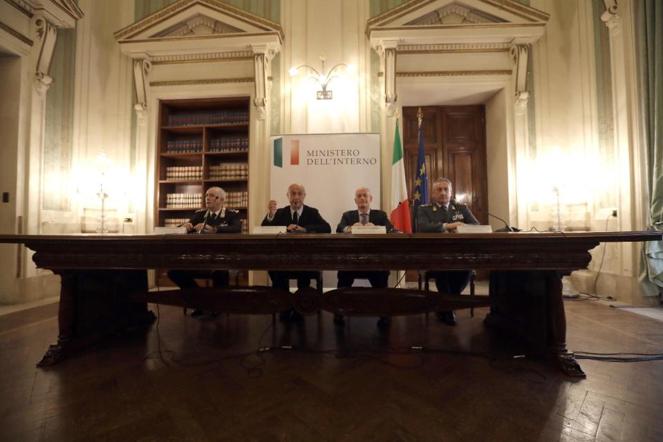 Italian Interior Minister Marco Minniti, second from left, is flanked by Rome's prefect Franco Gabrielli, second from right, Carabinieri commander General Tullio del Sette, left, and Financial Police commander general Giorgio Toschi, right, during a news conference in Rome, Friday, Dec. 23, 2016. Italy's interior minister Marco Minniti says the man killed in an early-hours shootout in Milan is "without a shadow of doubt" the Berlin Christmas market attacker Anis Amri. (AP Photo/Gregorio Borgia)
