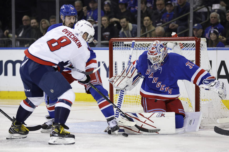 New York Rangers goaltender Igor Shesterkin stops a shot by Washington Capitals left wing Alex Ovechkin (8) during the second period of an NHL hockey game Wednesday, Dec. 27, 2023, in New York. (AP Photo/Adam Hunger)