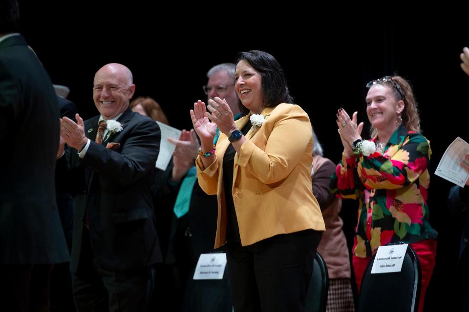 Lt. Gov. Kim Driscoll, center, joined Marlborough city councilors in applauding J. Christian Dumais after he was sworn in as the city's 44th mayor by City Clerk Steven Kerrigan at inauguration exercises at the Whitcomb School auditorium, Jan. 1, 2024.