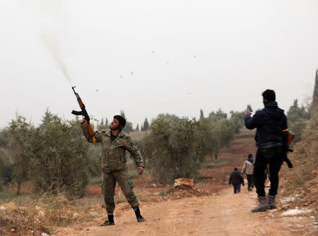 Turkish-backed Free Syrian Army fighters are seen near Mount Barsaya, northeast of Afrin, Syria January 22, 2018. REUTERS/Khalil Ashawi