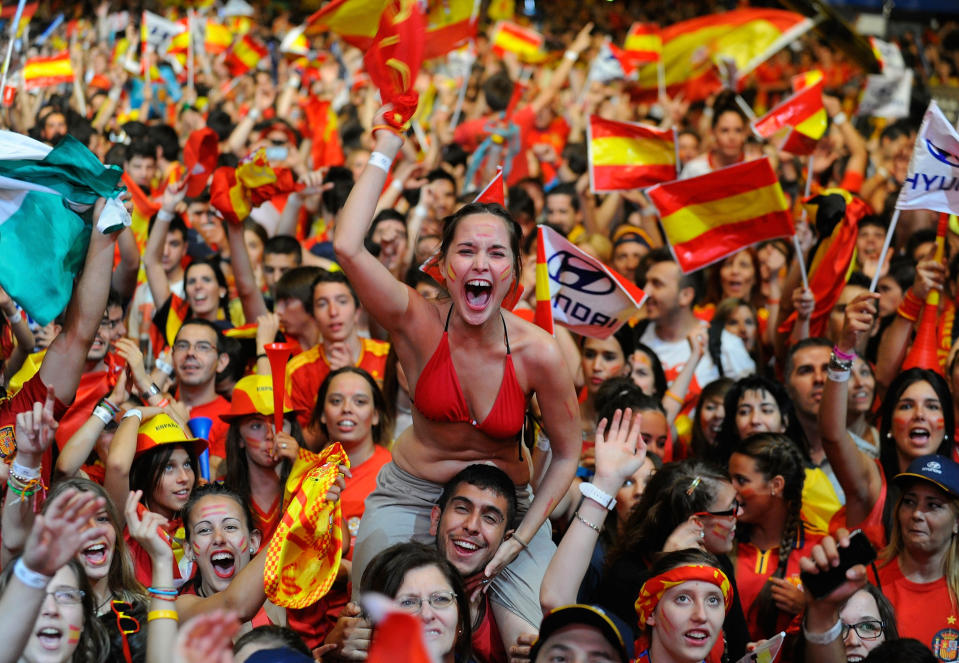 MADRID, SPAIN - JULY 01: Spain fans celebrates the UEFA EURO 2012 final match between Spain and Italy on a giant outdoor screen on Paseo de la Castellana on July 1, 2012 in Madrid, Spain. (Photo by Denis Doyle/Getty Images)