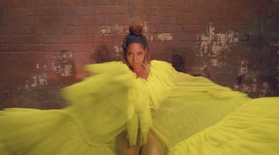 beyonce water yellow dress