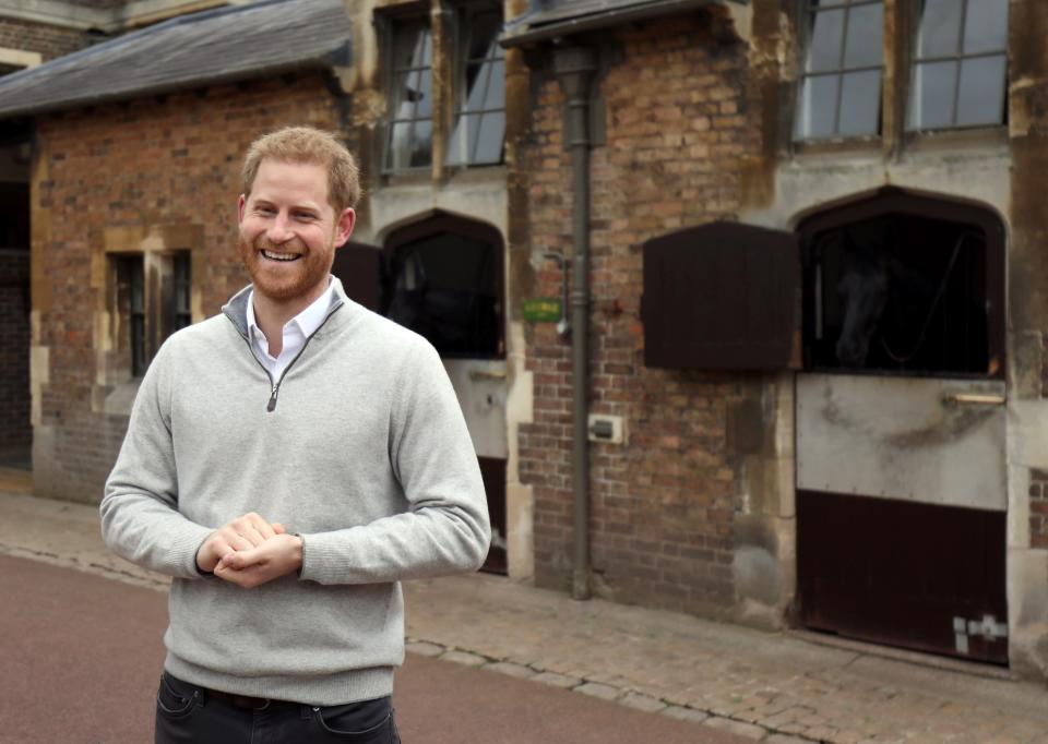 TOPSHOT - Britain's Prince Harry, Duke of Sussex, speaks to members of the media at Windsor Castle in Windsor, west of London on May 6, 2019, following the announcement that his wife, Britain's Meghan, Duchess of Sussex has given birth to a son. - Meghan Markle, the Duchess of Sussex, gave birth on Monday to a "very healthy" boy, Prince Harry announced. "We're delighted to announce that Meghan and myself had a baby boy early this morning -- a very healthy boy," a beaming Prince Harry said. (Photo by Steve Parsons / POOL / AFP)        (Photo credit should read STEVE PARSONS/AFP/Getty Images)