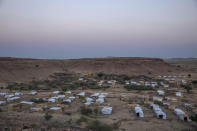 A general view of Umm Rakouba refugee camp which is currently hosting Tigray people who fled the conflict in Ethiopia's Tigray region, in Qadarif, eastern Sudan, Thursday, Nov. 26, 2020. Ethiopia's prime minister said Thursday the army has been ordered to move on the embattled Tigray regional capital after his 72-hour ultimatum ended for Tigray leaders to surrender, and he warned the city's half-million residents to stay indoors and disarm. (AP Photo/Nariman El-Mofty)