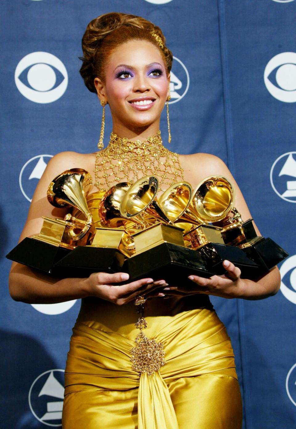 los angeles   february 8  singer beyonce knowles poses with her six grammys backstage in the pressroom at the 46th annual grammy awards held at the staples center on february 8, 2004 in los angeles, california  photo by  frederick m browngetty images