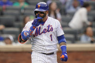 New York Mets' Jonathan Villar (1) gestures to teammates after hitting a home run in the eighth inning of a baseball game against the San Diego Padres, Saturday, June 12, 2021, in New York. (AP Photo/Frank Franklin II)