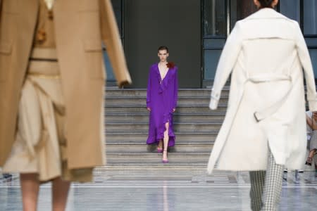 Models present creations during the Victoria Beckham catwalk show at London Fashion Week in London