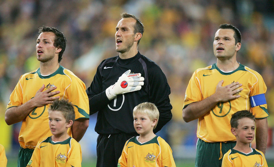 Lucas Neill, Mark Schwarzer, and Mark Viduka sing the Australian national anthem.