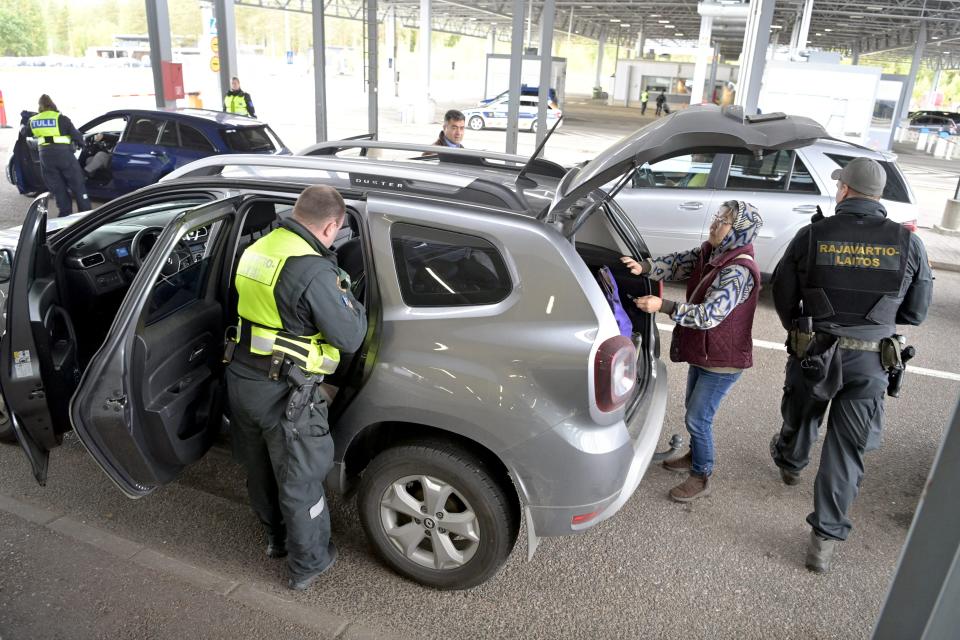 Finnish border guards check a Russian vehicle at the Vaalimaa border check point in Virolahti, Finland, on 25 September 2022 (AFP via Getty Images)