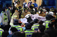 <p>Rescue workers remove a survivor from a hospital fire on January 26, 2018 in Miryang, South Korea. (Photo: Kim Gu-Yeon/Gyeongnam Domin Ilbo via Getty Images) </p>