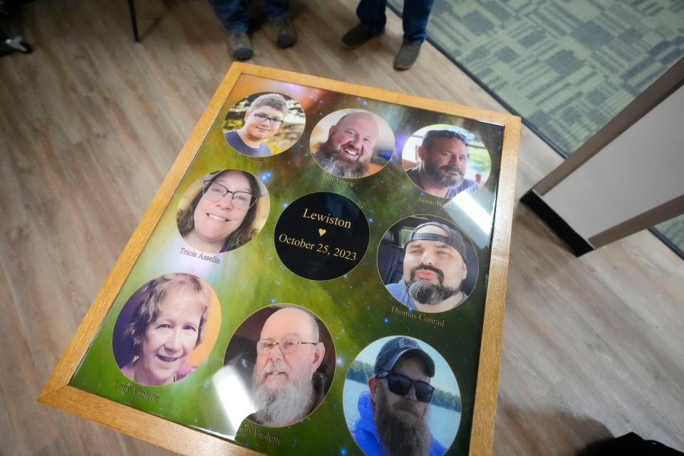 The eight people who were killed last October while bowling at Just In Time Recreation are memorialized on a table top at the bowling alley, Wednesday, May 1, 2024, in Lewiston, Maine. (AP Photo/Robert F. Bukaty)