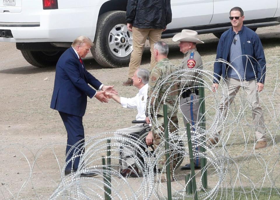 Gov. Greg Abbott greets Donald Trump in Eagle Pass on Thursday.