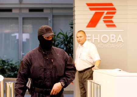 A members of Russia's FSB security service is seen in the offices of Renova during a search of the offices of its subsidiary, T Plus, which also shares the premises of Renova, in Moscow, Russia, September 5, 2016. REUTERS/Sergei Karpukhin