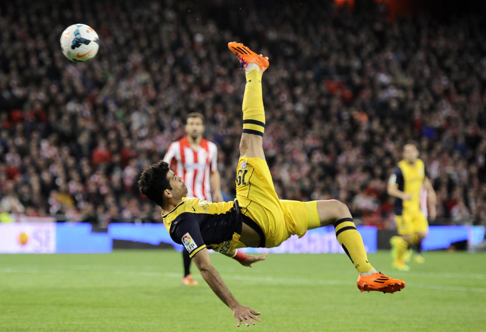 Atletico de Madrid's Diego Costa of Brazil, kicks the ball during their Spanish League soccer match against Athletic Bilbao, at San Mames stadium in Bilbao, Spain, Saturday, March 29, 2014. (AP Photo/Alvaro Barrientos)