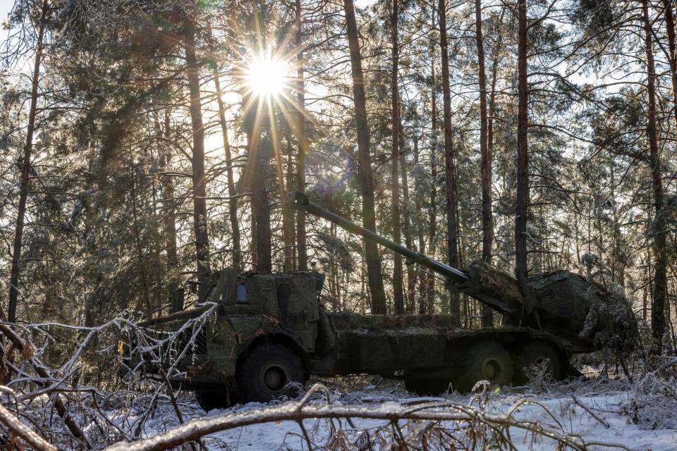 A Swedish-made Archer self-propelled howitzer system of Ukraine’s 45th separate artillery brigade sits in a forest in the Donetsk region on Saturday 16 December (REUTERS)